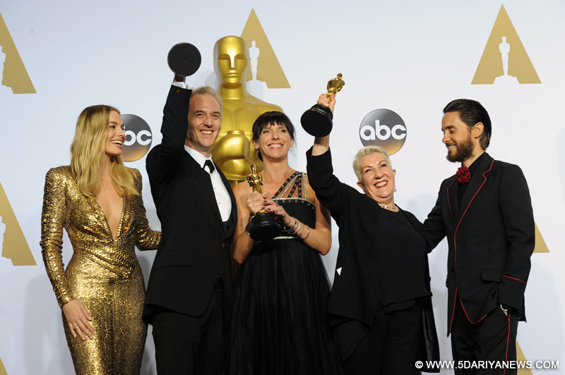Lesley Vanderwalt (2nd R), Elka Wardega(C) and Damian Martin (2nd L) of "Mad Max: Fury Road" pose after winning the best makeup and hairstyling award during the 88th Academy Awards at the Dolby Theater in Los Angeles, the United States,
