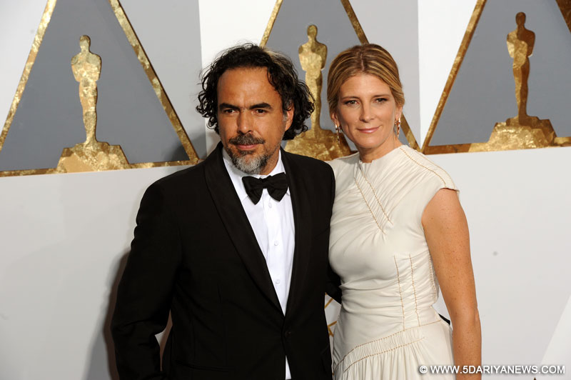 Alejandro G. Inarritu of "The Revenant", best directing nominee, and his wife Maria Eladia Hagerman arrive for the red carpet of the 88th Academy Awards at the Dolby Theater in Los Angeles, the United States