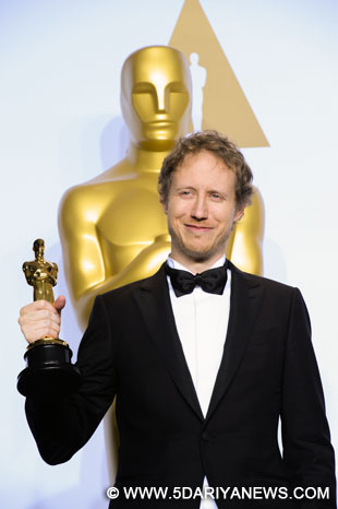 Director Laszlo Nemes of "Son Of Saul" (Hungary) poses after winning the best foreign language film award during the 88th Academy Awards at the Dolby Theater in Los Angeles, the United States.