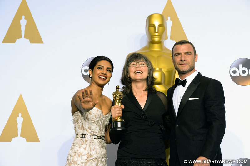 Margaret Sixel (C) of ``Mad Max: Fury Roa`` poses after winning the award for Best Film Editing during the 88th Academy Awards at the Dolby Theater in Los Angeles, the United States. Also seen Bollywood actress Priyanka Chopra. 