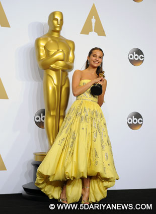 Alicia Vikander of "The Danish Girl" poses after winning the award for the actress in a supporting role, during the 88th Academy Awards at the Dolby Theater in Los Angeles, the United States.
