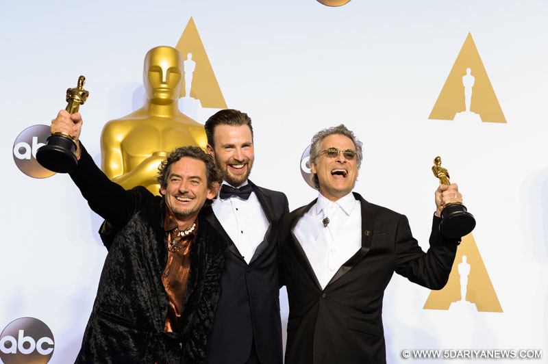 Mark Mangini (R) and David White (L) of "Mad Max: Fury Road" pose after winning the Best Sound Editing award during the 88th Academy Awards at the Dolby Theater in Los Angeles, the United States