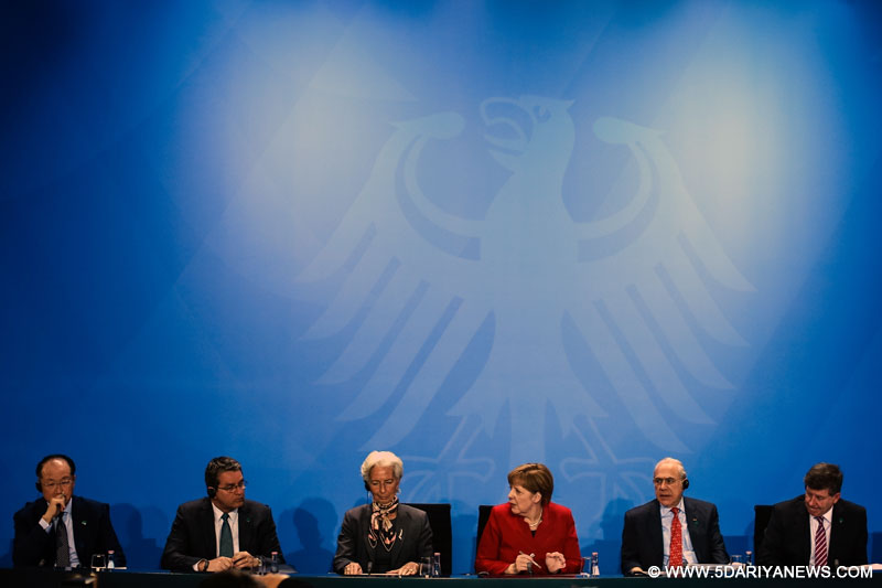 (from L to R) World Bank Group President Jim Yong Kim, WTO Director General Roberto Azevedo, Christine Lagarde, Managing Director of the International Monetary Fund, German Chancellor Angela Merkel, Angel Gurria, general secretary of the Organisation for Economic Cooperation and Development and Guy Ryder, general secretary of the World Labour Organisation attend a joint press conference in Berlin, Germany