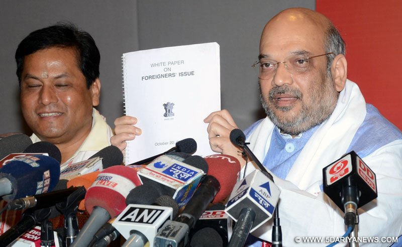 BJP chief Amit Shah addresses a press conference in Guwahati, on April 9, 2016. Also seen Union Sports Minister Sarbananda Sonowal. 