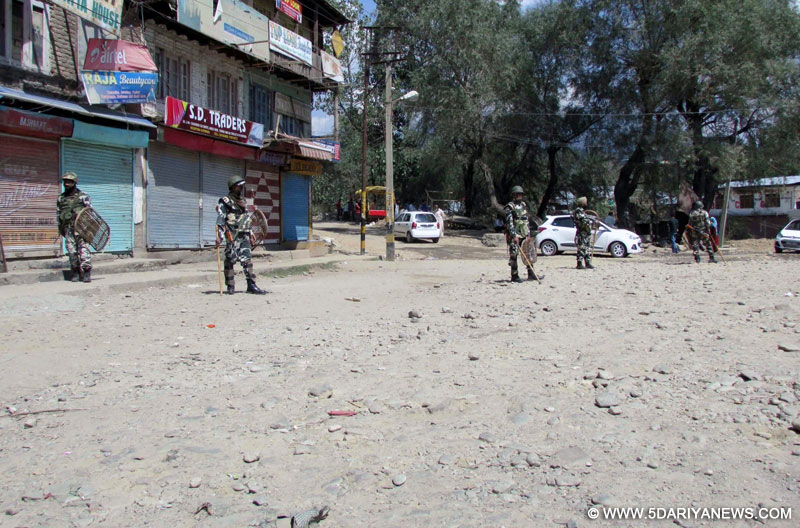 Security personnel enforce curfew in Kupwara of Jammu and Kashmir on April 17, 2016. 