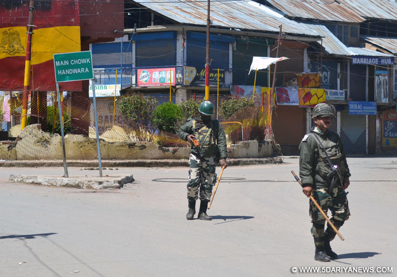 Security personnel enforce curfew in Handwara of Jammu and Kashmir on April 18, 2016.