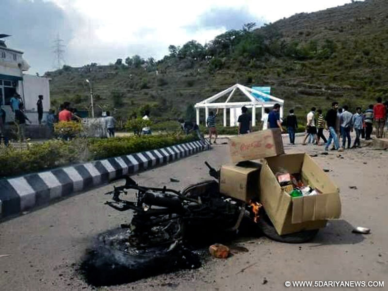 A bike that was set ablaze near Baba Ghulam Shah Badshah (BGSB) University in Jammu and Kashmir