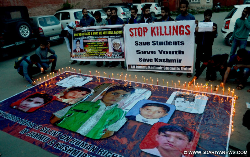 The members of All Jammu and Kashmir Students Union (AJKSU) participate in a candlelight vigil organised to condemn harassment of Kashmiri students in colleges across India in Srinagar on April 20, 2016.