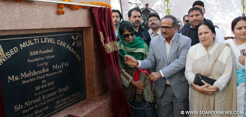 Jammu and Kashmir Chief Minister Mehbooba Mufti lays foundation of multi-level car parking at Super Bazaar in Jammu on April 30, 2016. Also seen Jammu and Kashmir Deputy Chief Minister Nirmal Singh.