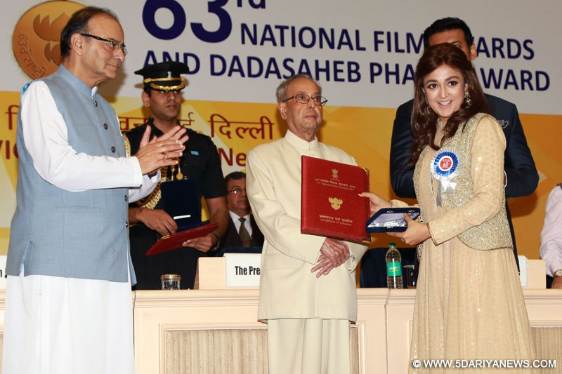 Singer Monali Thakur receives the Best Female Playback Singer award for the song "Moh moh ke dhaage" from "Dum Laga Ke Haisha" from President Pranab Mukherjee during the 63rd National Film Awards ceremony at Vigyan Bhawan in New Delhi, on May 3, 2016. 