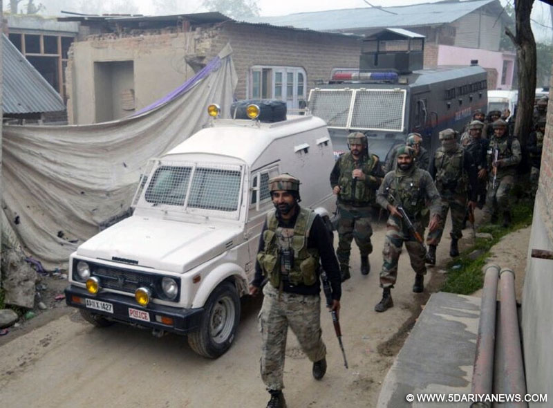 Security personnel at the site of encounter with Hizbul Mujahideen outfit militants in Pulwama of Jammu and Kashmir on on May 7, 2016. Three Hizbul Mujahideen outfit militants were killed in the gunfight.