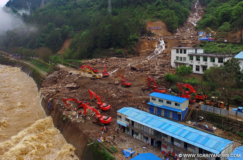Rescuers search for signs of life at the landslide site in Taining County, southeast China