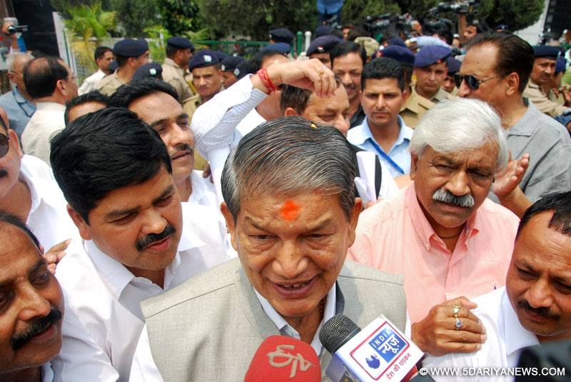Ousted Uttarakhand Chief Minister Harish Rawat talking to media after taking the floor test to prove his party`s majority outside the assembly in Dehradun on May 10, 2016. 