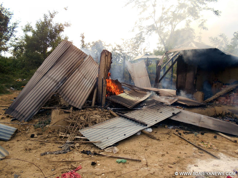 A house set on fire after people of two communities clashed in North Tripura May 15, 2016. 