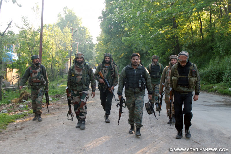 Soldiers during an operation against hiding militants in Pahlipora village of Shopian district on May 17, 2016. One militant was killed in the encounter.