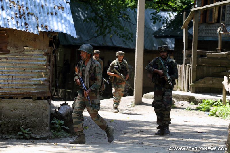 Security forces at the site of encounter with militants at Drugmulla near Kupwara in Kashmir on May 21, 2016.