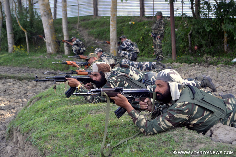 Security forces at the site of encounter with militants at Drugmulla near Kupwara in Kashmir on May 21, 2016.