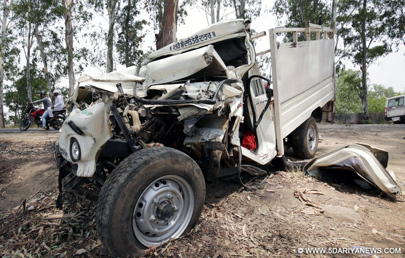 The mangled remains of the vehicle that crashed into a stationary truck on Gurdaspur-Amritsar highway near village Boparai in Amritsar district of Punjab on May 22, 2016. At least nine people were killed in the accident.