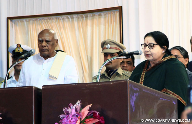 AIADMK general secretary Jayalalithaa swears in as Tamil Nadu chief minister at Madras University in Chennai, on May 23, 2016. Also seen Governor K Rosaiah.