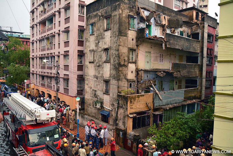 A portion of a building that collapsed during heavy rains in Kolkata on May 23, 2016. 
