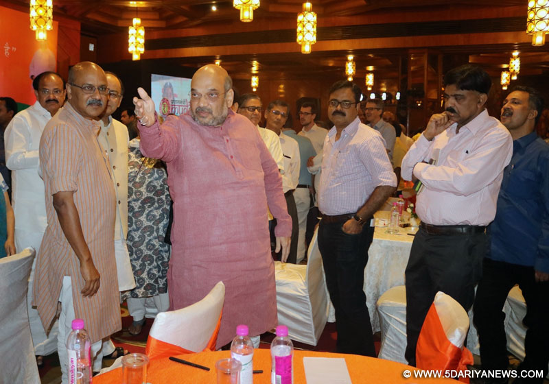 BJP chief Amit Shah with Union Ministers Arun Jaitley and M Venkaiah Naidu during a programme organised to interact with journalists regading the achievements of NDA government in last two years, in New Delhi on May 25, 2016. 