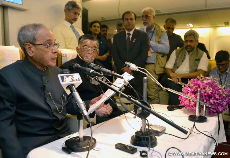 The President, Shri Pranab Mukherjee interacting with the accompanying media delegation during his way back to India from Beijing on May 27, 2016. The Minister of State for Textiles (Independent Charge), Shri Santosh Kumar Gangwar is also seen.