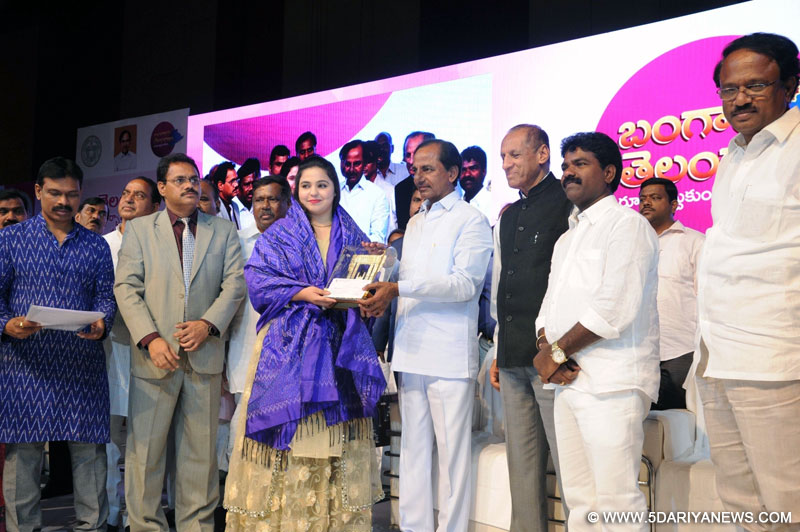  Telangana Chief Minister K Chandrashekar Rao presents award to karate athlete Syeda Falak during a programme organised on the occasion of the state