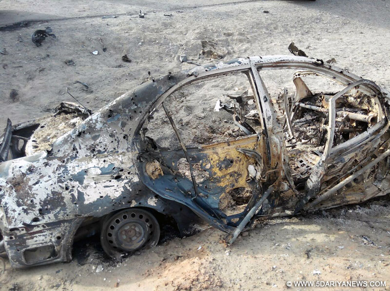 Photo taken with mobile phone on May 22, 2016 shows a destroyed vehicle believed to be hit by a U.S. drone strike in Ahmad Wal, a small town in Pakistan
