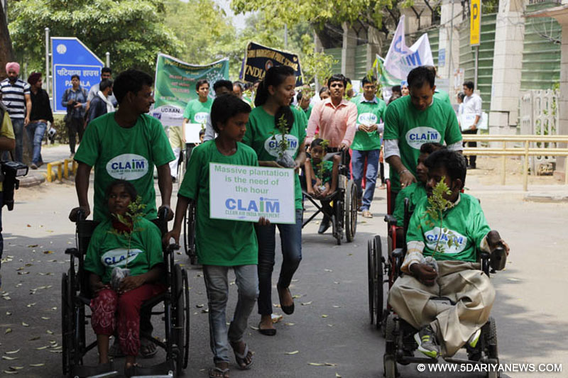 Handicapped students participating in a plantation drive on the occasion of World Environment Day