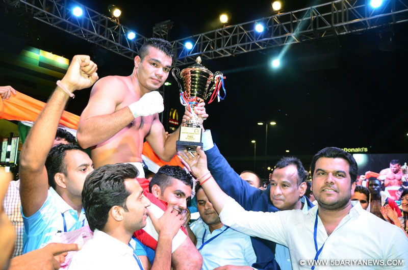 Indian boxer Vikas Krishan Yadav celebrates after winning the match against Kenya