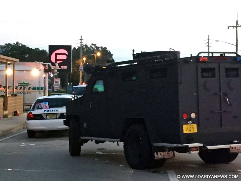Photo provided by Orlando Police Department shows police vehicles at the site of the shooting incident in Orlando, Florida, the United States, June 12, 2016. About 50 people were killed and 53 others wounded early Sunday morning in a shooting incident at a gay nightclub in Orlando, Florida, according to Orlando mayor
