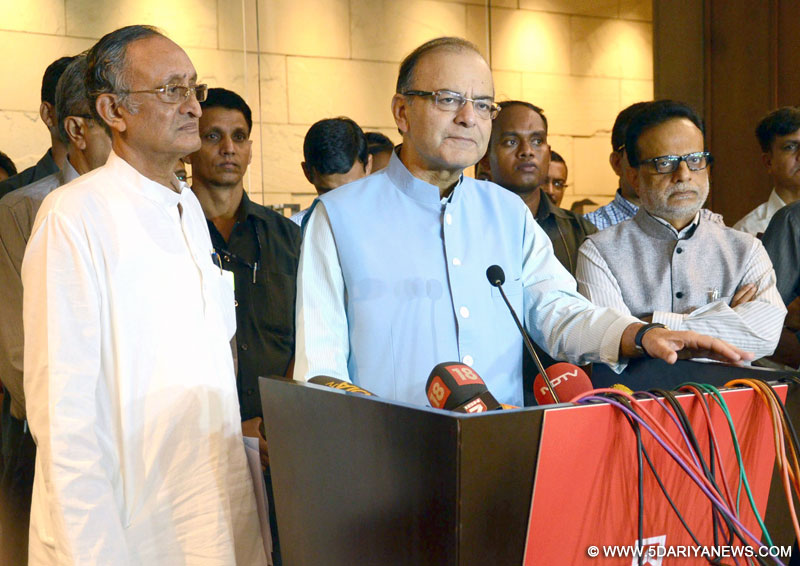 The Union Minister for Finance, Corporate Affairs and Information & Broadcasting, Shri Arun Jaitley briefing the media on the meeting of the Empowered Committee on GST, in Kolkata on June 14, 2016. The Minister of Finance, Excise, Commerce & Industries, Public Enterprises and Industrial Reconstruction, West Bengal, Shri Amit Mitra and the Secretary, Revenue, Dr. Hasmukh Adhia are also seen.