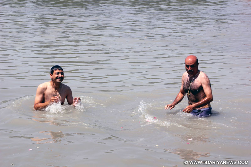 Ganderbal: Kashmiri Pandits take holy dip at Sangam - the confluence of Jhelum river and Sindh stream in Ganderbal district of Jammu and Kashmir on Maha Kumbh in Srinagar, on June 14, 2016. 