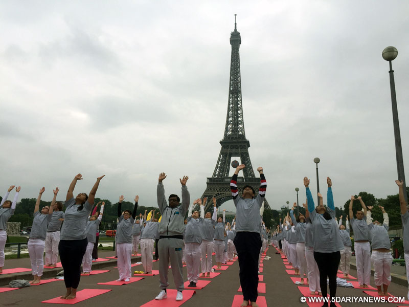Participants at the yoga day event at the iconic Eiffel Tower in Paris, France.