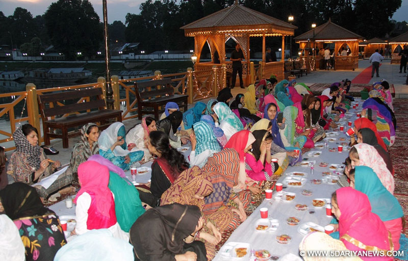 Jammu and Kashmir Chief Minister Mehbooba Mufti with orphan girls during an iftaar party at Zero Bridge over Jhelum river in Srinagar, on June 20, 2016. 