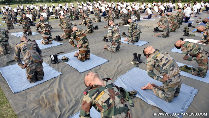 Army soldiers practice yoga asanas on International Day of Yoga in Chennai on June 21, 2016. 