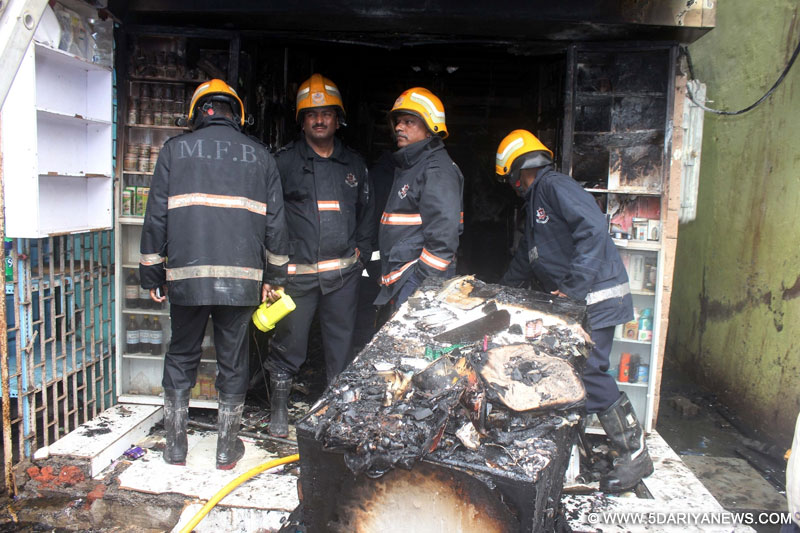  Fire fighters try to douse a fire that broke out at a Mumbai pharmacy on June 30, 2016. Reportedly nine persons, including three infants, were killed. 