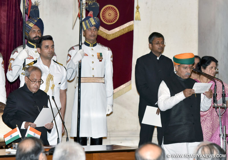 The President, Shri Pranab Mukherjee administering the oath as Minister of State to Shri Arjun Ram Meghwal, at a Swearing-in Ceremony, at Rashtrapati Bhavan, in New Delhi on July 05, 2016.