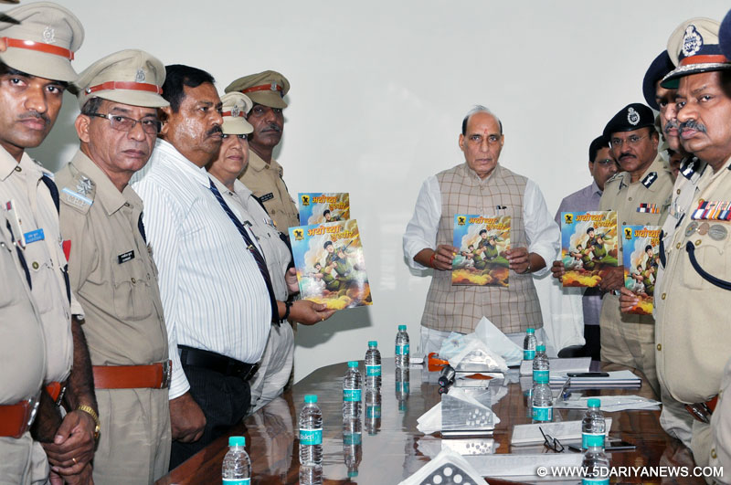 The Union Home Minister, Shri Rajnath Singh releasing an illustrative book of the Central Reserve Police Force (CRPF) titled “Ayodhya ke Shoorvir”, in New Delhi on July 05, 2016. The DG, CRPF, Shri K. Durga Prasad and other senior officers of the Force are also seen. 