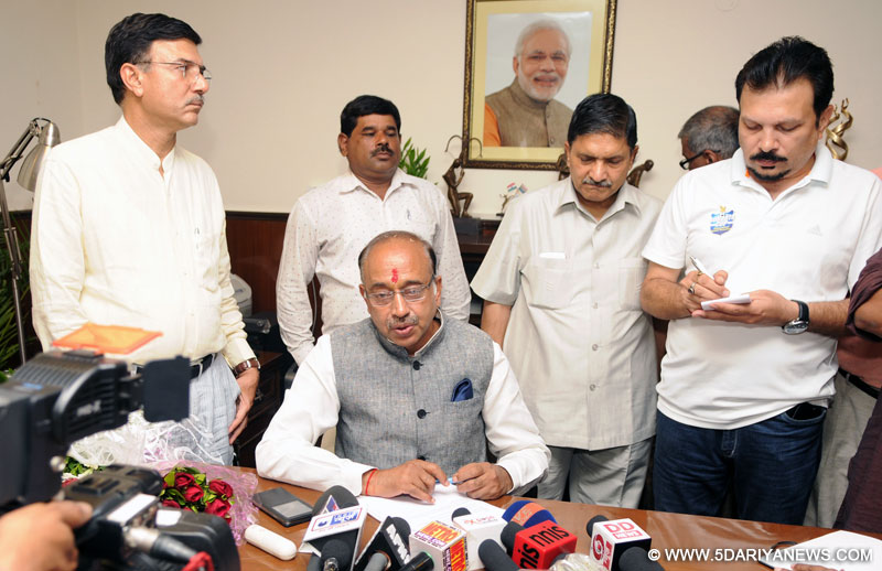 Vijay Goel addressing the press conference after taking charge as Minister of State (Independent Charge) for Youth Affairs and Sports, in New Delhi on July 06, 2016. The Secretary, Ministry of Youth Affairs & Sports, Shri Rajiv Yadav is also seen.