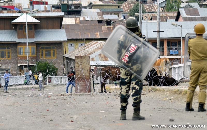 Protesters clash with security personnel in Baramulla of Jammu and Kashmir on July 11, 2016. 