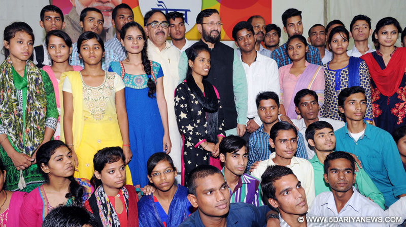 The Union Minister for Human Resource Development, Shri Prakash Javadekar in a group photograph with the students, who cleared XII with high marks and got admission to reputed colleges, at a function, in New Delhi on July 17, 2016. The Secretary, School Education and Literacy, Dr. Subash Chandra Khuntia is also seen.