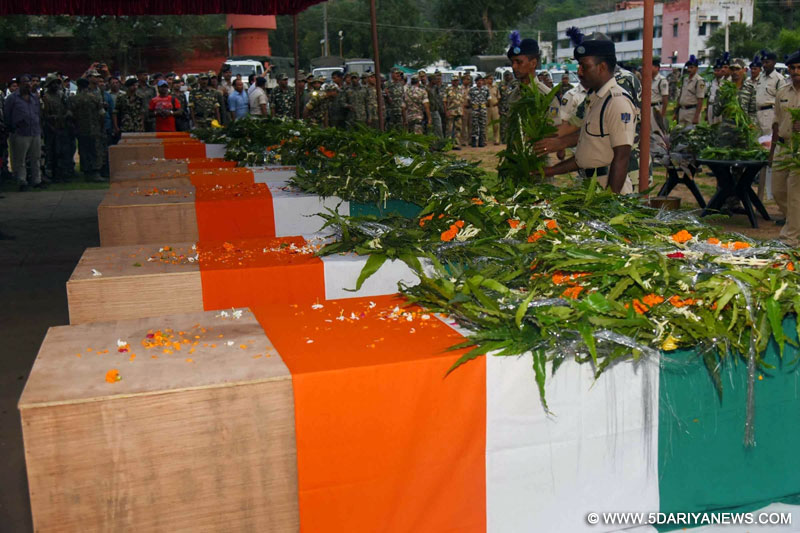 CRPF personnel pays tribute to the 10 CRPF troopers gunned down by Maoists on Monday (18 July) near the border of Imamganj and Aurangabad police station; in Gaya on July 19, 2016. 