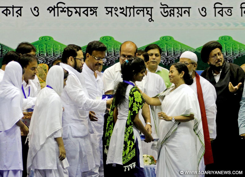West Bengal Chief Minister Mamata Banerjee during a minority development programme in Kolkata on Aug 1, 2016. Also seen Firhad Hakim and Sultan Ahmed.