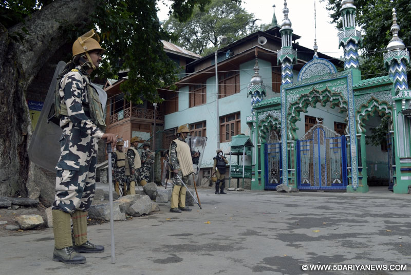 Security forces keep a strict vigil as authorities clamp curfew and restrictions amid protest shutdown called by separatists at Khanpora of Baramulla district in Jammu and Kashmir, on Aug 3, 2016. 