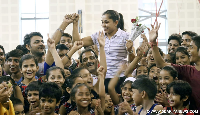 New Delhi: Indian gymnast Dipa Karmakar welcomed by budding athletes at IG stadium after her return from Rio 2016 Olympic; in New Delhi on Aug 20, 2016.