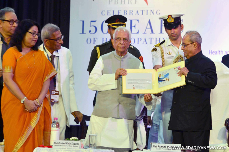 The President, Shri Pranab Mukherjee being presented a special cover on 150 years of Homeopathy by the Governor of West Bengal, Shri Keshari Nath Tripathi, at a function ‘The Legacy to Humanity: Celebrating 150 years of Homeopathy’, organised by the Dr. Prasanta Banerji Homeopathic Research Foundation, in Kolkata on August 22, 2016.