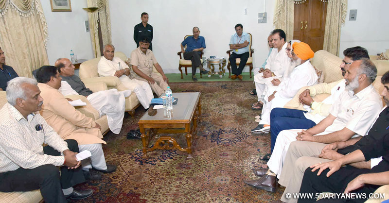 A BJP delegation led by J&K State President, Shri Sat Sharma meeting the Union Home Minister, Shri Rajnath Singh, in Srinagar on August 24, 2016.