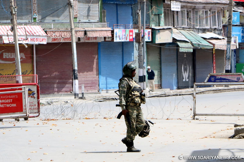  A soldier mans a street as strike called by separatists continue in Srinagar on Sep1, 2016.