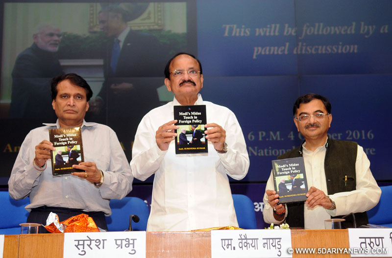 The Union Minister for Urban Development, Housing & Urban Poverty Alleviation and Information & Broadcasting, Shri M. Venkaiah Naidu along with the Union Minister for Railways, Shri Suresh Prabhakar Prabhu releasing the book “Modi’s Midas touch in Foreign Policy”, written by Ambassador Surendra Kumar, in New Delhi on October 04, 2016. 